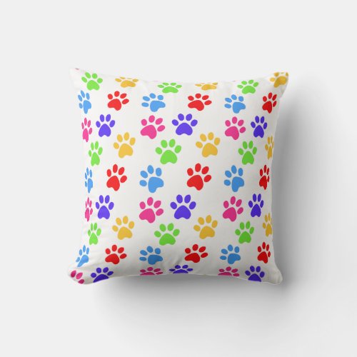 Multicolored dog  cat paws on white throw pillow