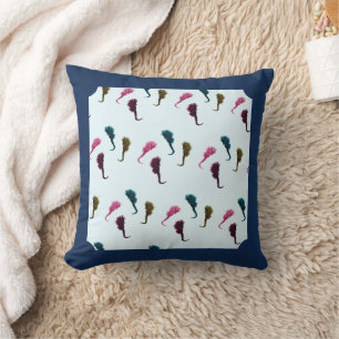 Multicolored handmade seahorses in blue ocean throw pillow