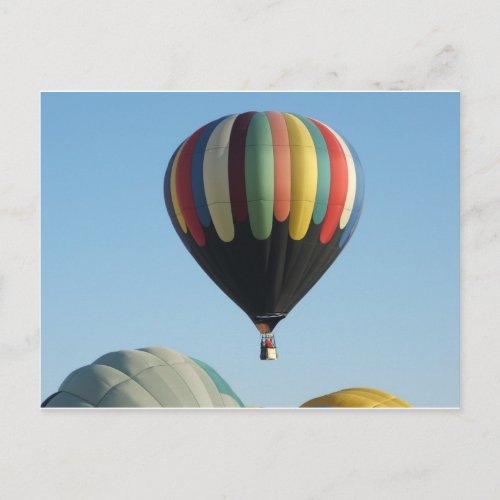 Multicolored hot air balloons postcard