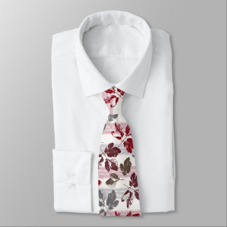 Multicolored leaves on a striped background. neck tie