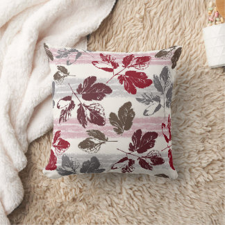 Multicolored leaves on a striped background. throw pillow