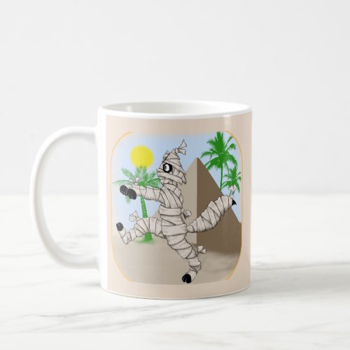 mummy cat walking past the pyramid coffee mug