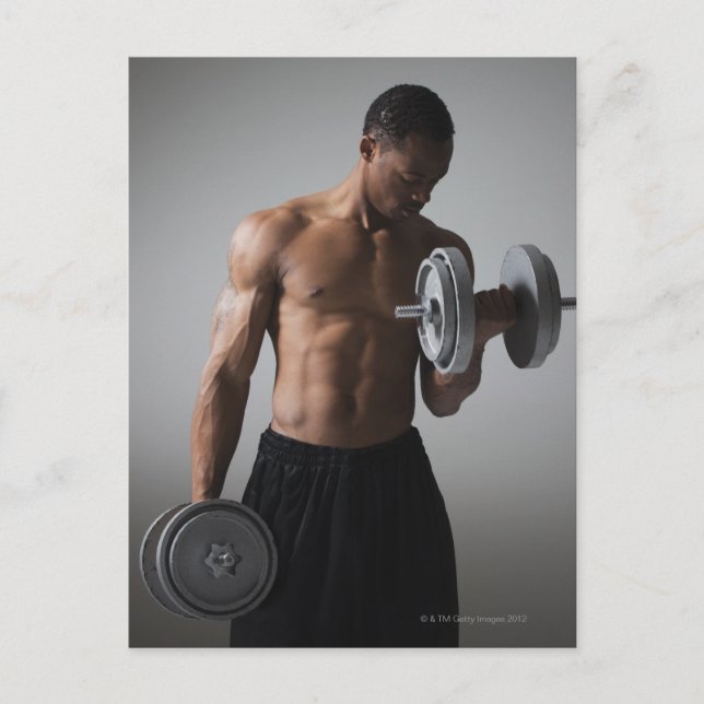 Muscular man lifting dumbbells postcard (Front)