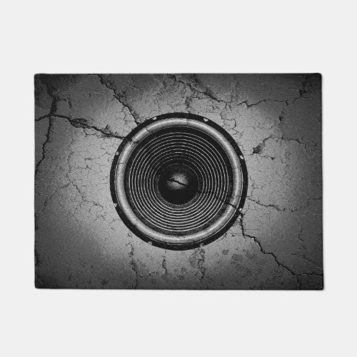 Music speaker on a cracked wall doormat