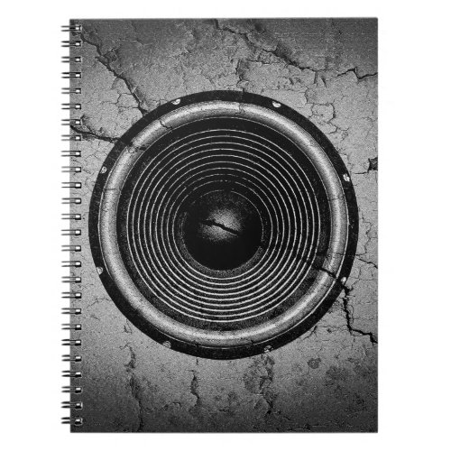 Music speaker on a cracked wall notebook