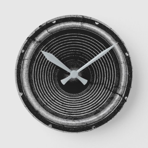 Music speaker on a cracked wall round clock
