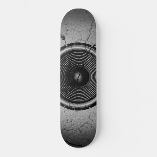 Music speaker on a cracked wall skateboard deck