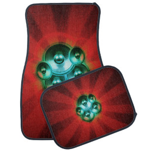 Music speakers and red sunburst car floor mat