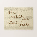 Music Speaks Jigsaw Puzzle<br><div class="desc">This pretty design features the sentiment, "When words fail, music speaks", on an almond toned sheet music look background.</div>