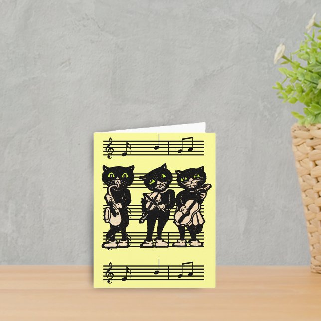 Musical Black Cats Note Card (Three black cat musicians playing instruments on sheet of music on bright yellow notecards.)