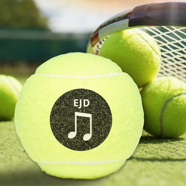 Musical Note Monogrammed Music Lovers Tennis Ball (A monogrammed tennis ball with musical notes design on a black circle)