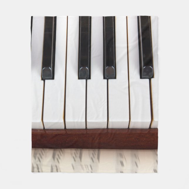 musical notes on the background of a pianoacoustic fleece blanket (Front)