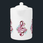 Musical treble clef notes with Sakura flowers Teapot<br><div class="desc">Pink treble clef with delicate,  detailed pink Japanese cherry blossoms against white background painted over with light blue paint. Blooming pink sakura.</div>