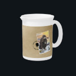 Muskox Stamp Souvenir Pitcher<br><div class="desc">A perfect souvenir from that trip to Alaska with a copy of the 3-nugget Muskox stamp cancelled in Anchorage. The image features a  hypothetical postage stamp of an independent Alaska depicting a bull muskox on the tundra. Muskox are called oomingmak (the bearded one) in the Inuit language.</div>