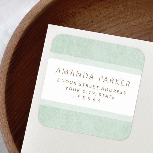 Muted green borders return address labels