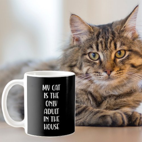 My cat is the only adult in the house funny coffee mug