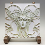 Mystique of Nouveau Woman Ceramic Tile<br><div class="desc">Behold the mystique of the Nouveau era with this captivating ceramic tile, where elegance and artistry converge. Central to this piece is the serene visage of a Nouveau woman, her features softly sculpted amidst a cascade of flowing, creamy tendrils that seem to dance around her. The background and elements are...</div>