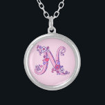 N monogram decorative letter necklace<br><div class="desc">Pretty letter N monogram pendant. Whimsical letter drawing of the capital initial letter N ideal for gifting girls with a name that begins with N. Background color can be changed if required,  currently light pink. © Original drawing and design by Sarah Trett www.sarahtrett.com for www.mylittleeden.com</div>