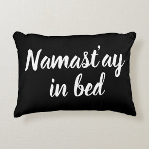 Namastay in bed brush script lettering funny black accent pillow