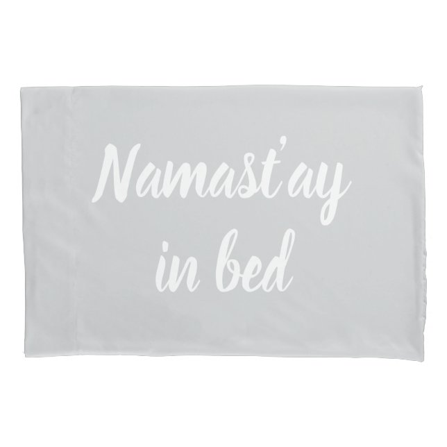 Namastay in bed brush script lettering light grey pillow case (Front)