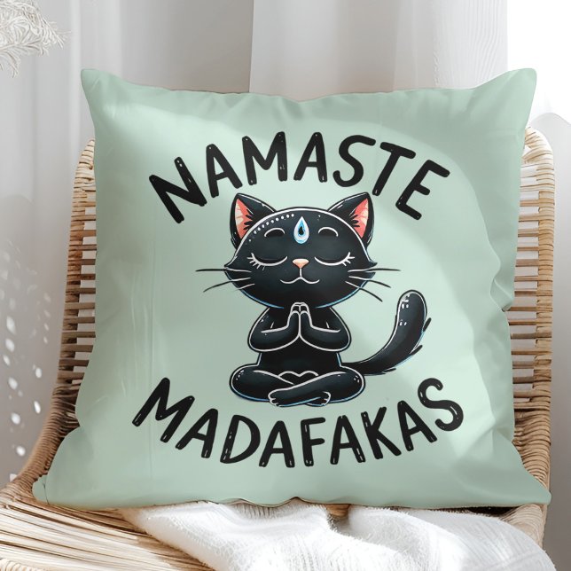 "Namaste Madafakas" Funny Cat Lovers Throw Pillow ("Namaste Madafakas" Funny Cat Lovers Throw Pillow on a sunny boho rattan chair.)