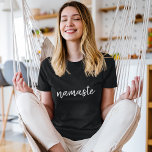 Namasté | Modern Black Meditation Spiritual Yoga T-Shirt<br><div class="desc">Simple, stylish "namaste" quote art design in modern minimalist handwritten script typography. The slogan can easily be personalized with your own words for a perfect gift for a yoga bunny or pilates lover! Namasté literally means "greetings to you." In the Vedas, namaste mostly occurs as a salutation to a divinity....</div>