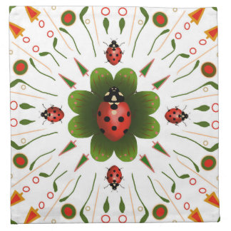 Napkins with ladybug design, red & green on white.