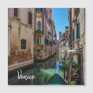 Narrow street with canal in Venice