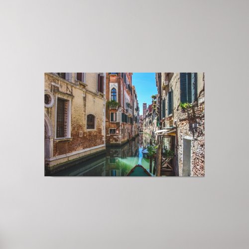 Narrow street with canal in Venice Canvas Print