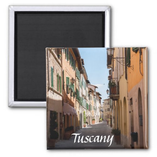 Narrow street with old facades in tuscany village magnet
