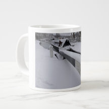 Narrowboat on the canal during a snowy day