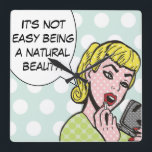 Natural Beauty Comic Book Wall Clock<br><div class="desc">This whimsical wall clock is sure to bring a smile to your lips. The Natural Beauty Comic Book Wall Clock features a lovely young woman applying red lipstick and a speech bubble that says, "It's not easy being a natural beauty." The girl and speech bubble are on a robin's egg...</div>