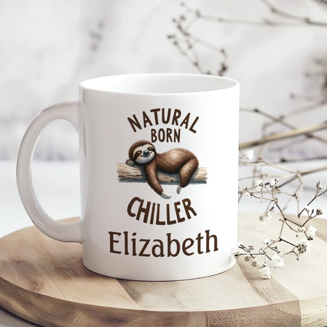 "Natural Born Chiller" Cute Sloth & Custom Name Coffee Mug ("Natural Born Chiller" Cute Sloth & Custom Name Coffee Mug on a boho wooden kitchen table.)