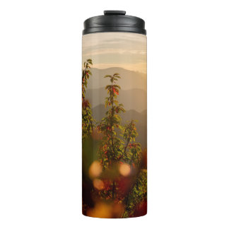 Nature photography of green trees overlooking moun thermal tumbler