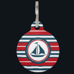 Nautical design pet ID tag<br><div class="desc">Nautical design with sailing boat decoration in round shape on red, blue and white striped background</div>