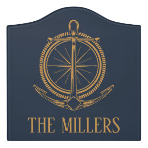 Nautical design with gold compass and anchor door sign