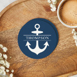 Nautical Navy Blue Anchor Custom Monogram Name Round Paper Coaster<br><div class="desc">Modern and elegant nautical custom family monogrammed paper coaster features a coastal style with boat anchor and intersecting striped monogram text that can be personalized with a last name. Navy blue and white design can be customized.</div>