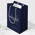 Nautical Navy Blue Personalized Groomsmen Medium Gift Bag<br><div class="desc">Add a personal touch to your wedding with personalized groomsmen gift bag. This gift bag features personalized groomsman's name with title and wedding date in white and monogram in light navy blue as background, in classic serif font style, on navy blue background. Also perfect for best man, father of the...</div>