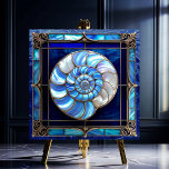 Nautilus Shell in Blue Stained-Glass Look Ceramic Tile<br><div class="desc">The Nautilus Shell in Blue Stained-Glass Look Ceramic Tile features a beautiful nautilus shell in blues and pearl white on a background of blue. This tile has a stained-glass look with trim in antique silver. There are many wonderful applications for these beautiful tiles. Available in 2 sizes 4.25" x 4.25...</div>
