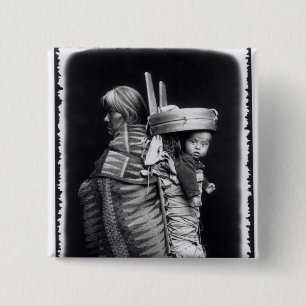 Navaho woman carrying a papoose on her back pinback button