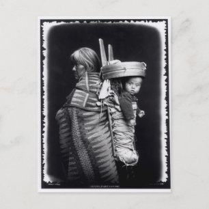 Navaho woman carrying a papoose on her back postcard