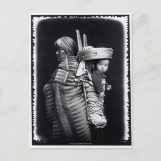 Navaho woman carrying a papoose on her back postcard