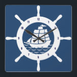 Navy Blue And White Nautical Wheel Square Wall Clock<br><div class="desc">White nautical boat wheel with blue numbers with custom navy blue background.</div>