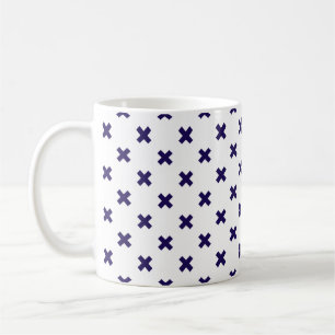 Navy blue cross stitches on white coffee mug