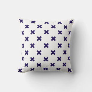 Navy blue cross stitches on white throw pillow