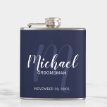 Navy Blue Modern Script Personalized Groomsmen Flask<br><div class="desc">Add a personal touch to your wedding with personalized groomsmen flask. This flask features personalized groomsmen's name in white modern script font style and monogram in light blue modern script font style as background with title and wedding date in white modern sans serif font style on navy blue background. Also...</div>