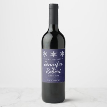 Navy Blue Snowflake Winter Wedding Wine Label by NoteableExpressions at Zazzle