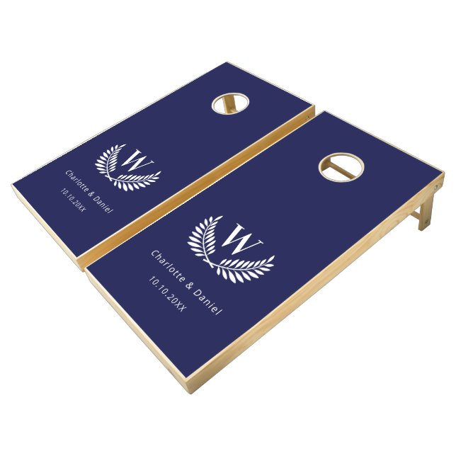 Navy blue white laurel wreath monogram wedding cornhole set (Angled)
