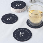 Navy Blue & White Wedding Monogram Round Paper Coaster<br><div class="desc">Solid navy blue coasters for your wedding cocktail hour or reception feature your initials worked into a monogram design,  joined by a decorative script ampersand. Your names and wedding date appear in white lettering,  curved around the outside. Designed to coordinate with our Ampersand Monogram wedding invitation collection.</div>