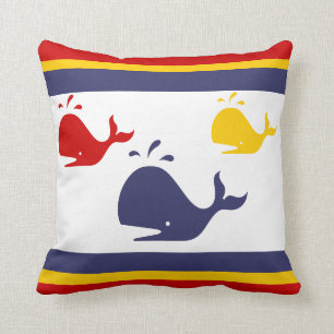 navy blue, yellow, and red whales on white throw pillow